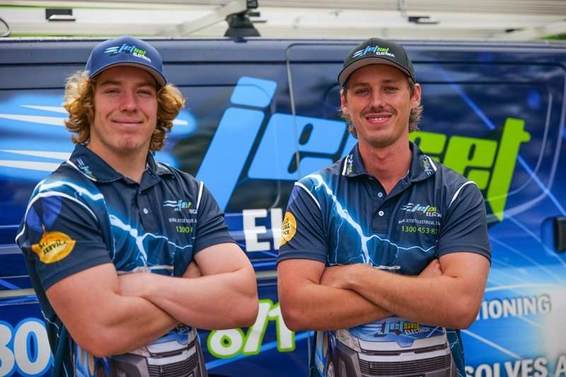 2 Electricians infront of a jetset electrical van
