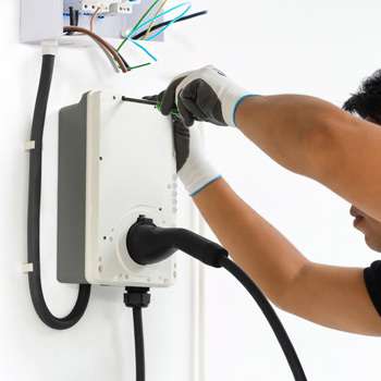 Electrician fitting an EV Charger